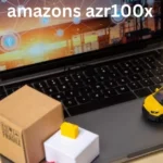 a laptop witha toy car and boxes on it